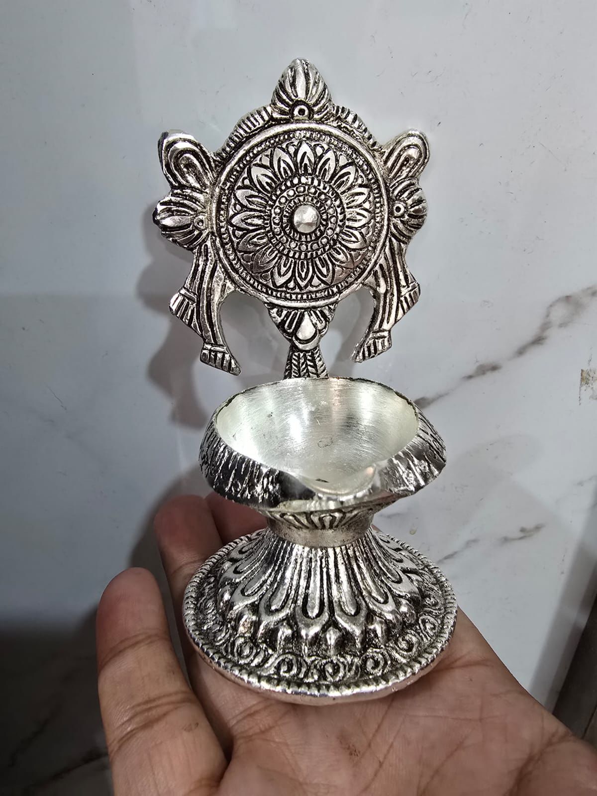 German Silver Antique Finish Diya with Intricate Floral Backplate