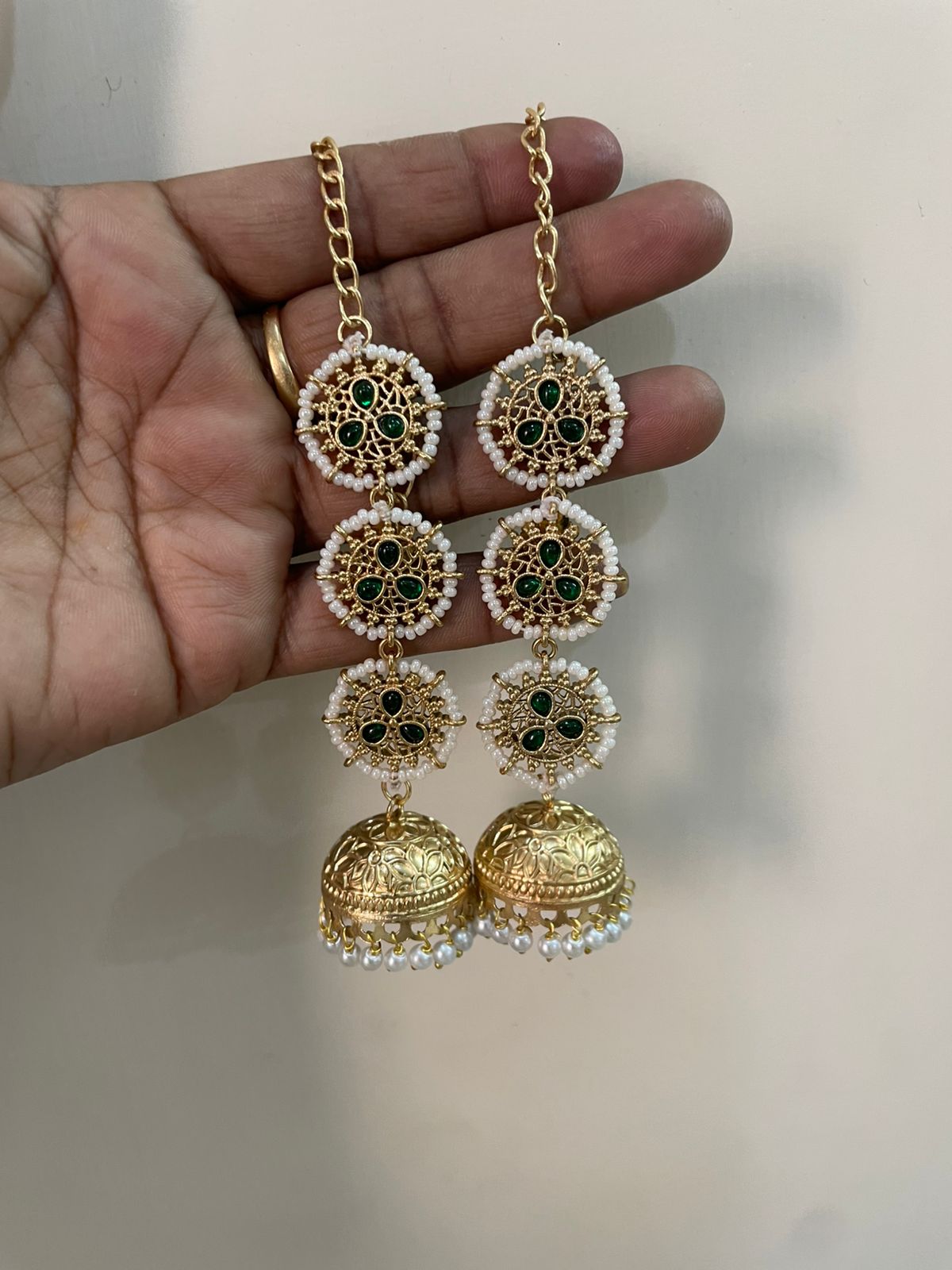 Gold Plated Long Chain Jhumka Earrings with Emerald Green Stones