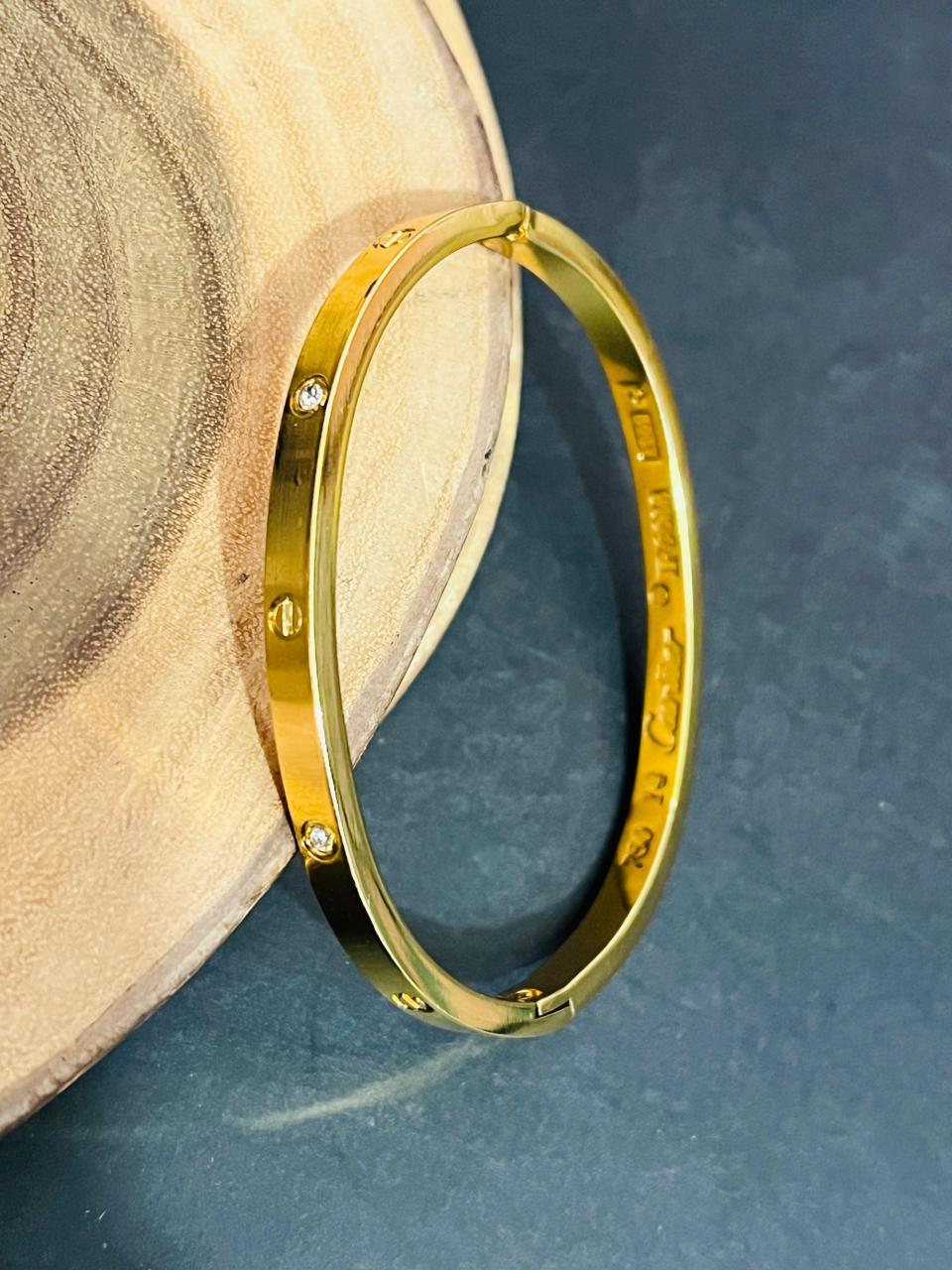 Iconic Screw Motif Oval Bangle – Gold Plated with Crystals