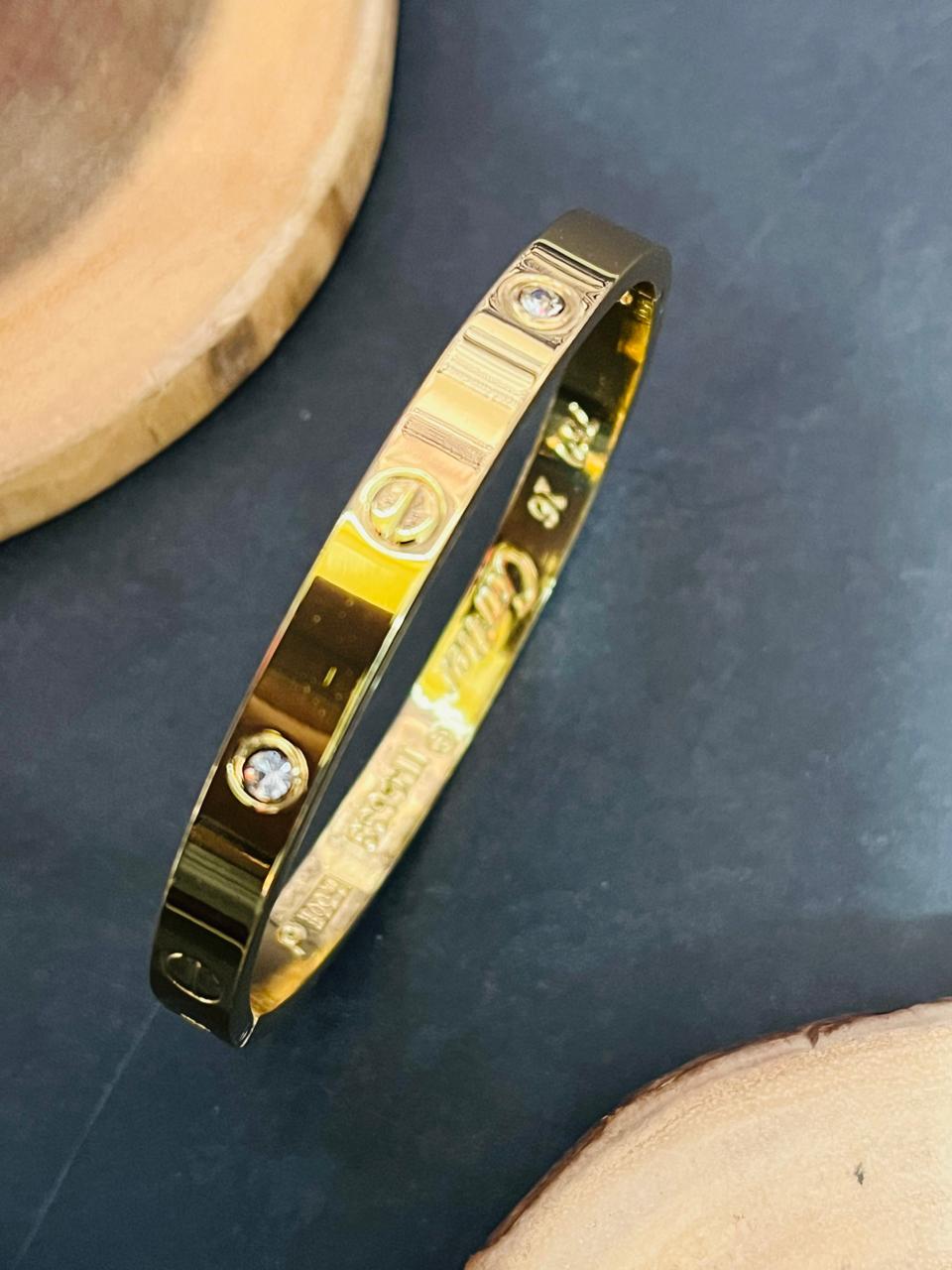 Iconic Screw Motif Oval Bangle – Gold Plated with Crystals